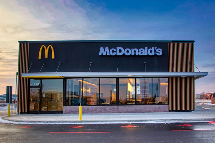 Modern McDonald’s building with neutral branding and sleek design, sourced from QSR Magazine